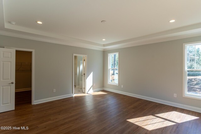 unfurnished room featuring ornamental molding, dark wood-type flooring, and french doors