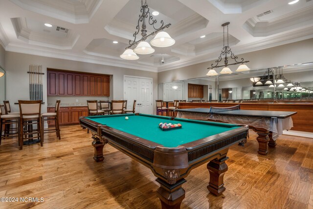 game room with light wood-style flooring, visible vents, and ornamental molding