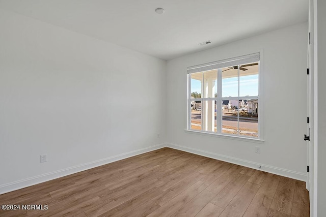 unfurnished room featuring light wood-type flooring