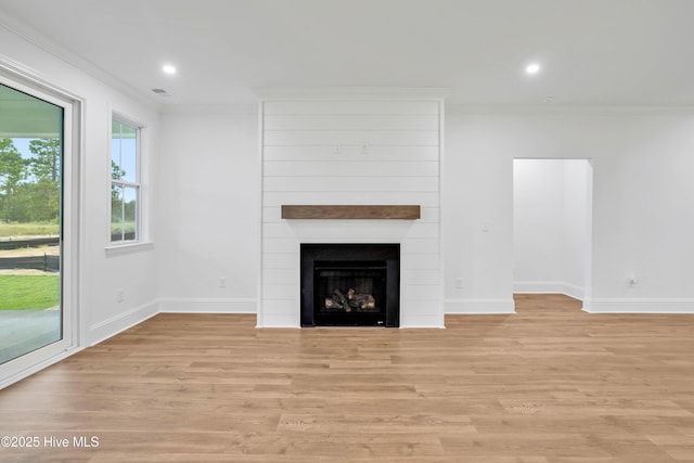 1320 Trisail Ter, Wilmington, NC 28412 - unfurnished living room featuring baseboards, ornamental molding, and a fireplace