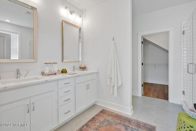 bathroom with vanity, tile patterned flooring, and a shower with shower door