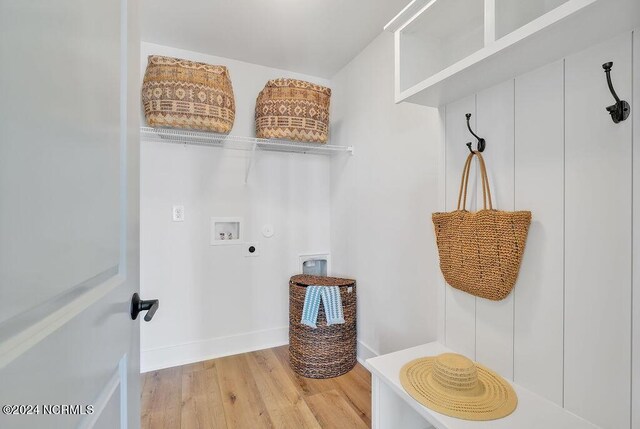 laundry room featuring electric dryer hookup, hookup for a gas dryer, wood-type flooring, and washer hookup