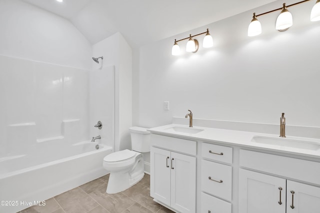 1320 Trisail Ter, Wilmington, NC 28412 - bathroom featuring double vanity, a sink, lofted ceiling, and toilet