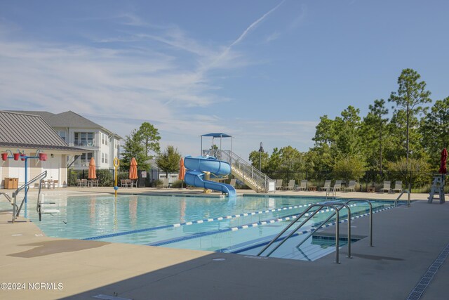 1320 Trisail Ter, Wilmington, NC 28412 - pool featuring a patio, a water slide, and fence
