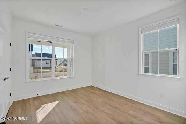 spare room featuring light wood-type flooring