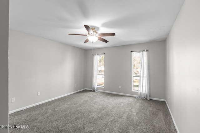 empty room featuring carpet flooring and ceiling fan