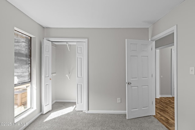 unfurnished bedroom featuring a closet and carpet