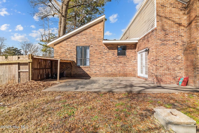 rear view of property with french doors and a patio