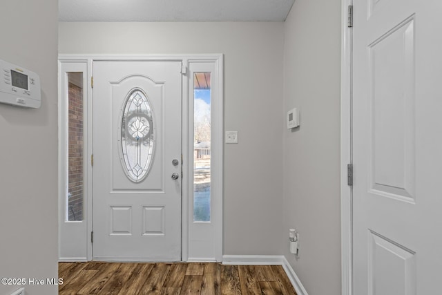 entryway with dark wood-type flooring