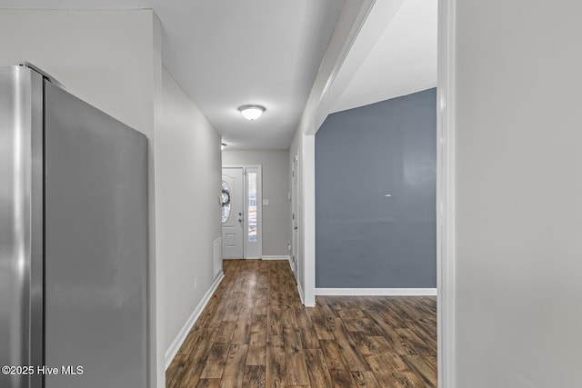 hallway with dark hardwood / wood-style flooring