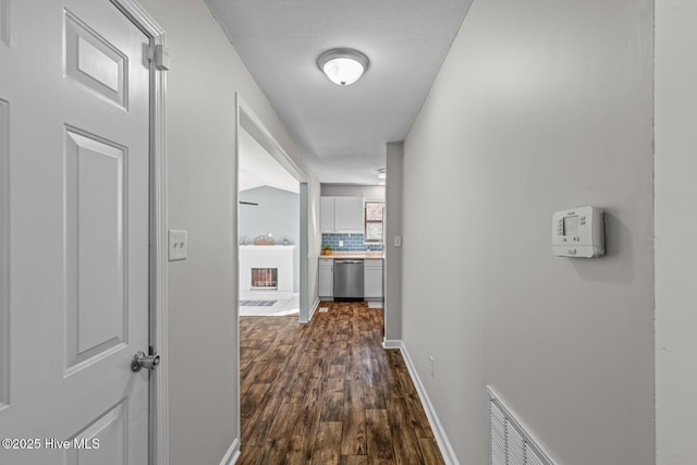 hall with dark hardwood / wood-style flooring