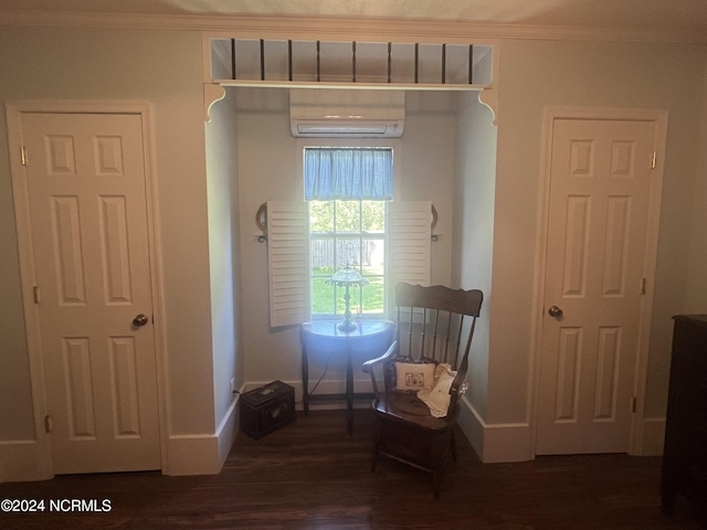 unfurnished room with dark wood-type flooring, crown molding, baseboards, and a wall mounted AC