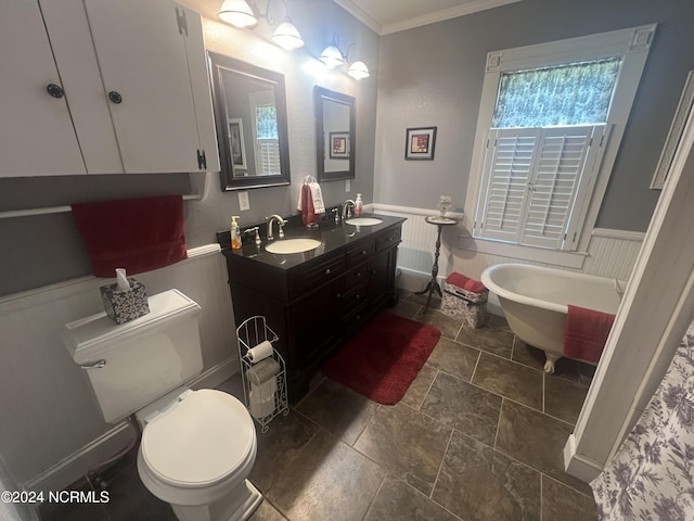 full bathroom with a wainscoted wall, crown molding, and a sink