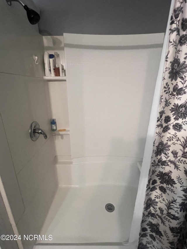 full bath featuring a stall shower