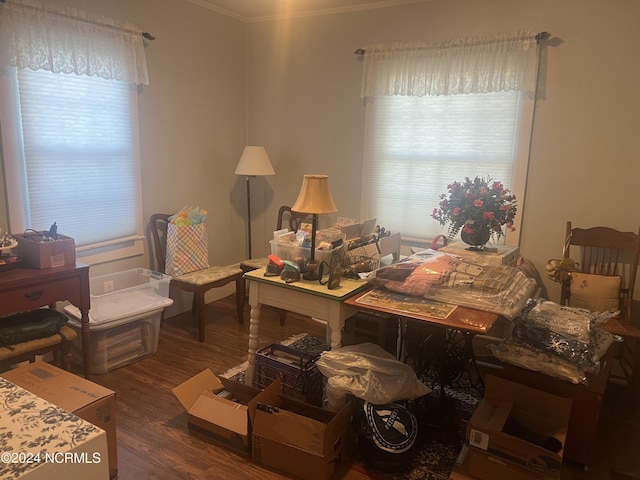 office area with dark wood-style floors and ornamental molding