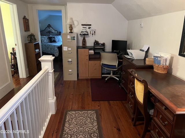 office with lofted ceiling and dark wood finished floors