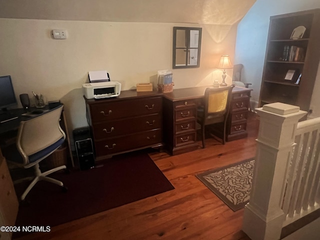 office area with vaulted ceiling and wood finished floors