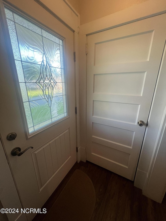 doorway featuring dark wood-style floors