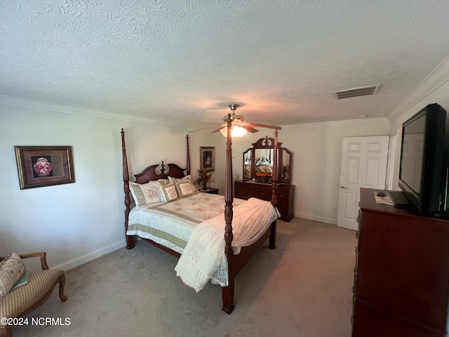 bedroom with ceiling fan, crown molding, light carpet, and a textured ceiling