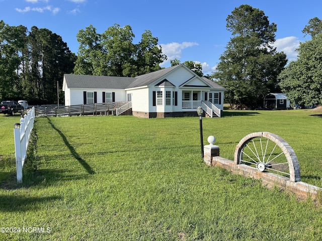 view of front of house with a front yard and a porch