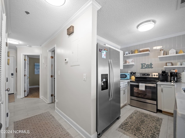 kitchen with stainless steel appliances, white cabinetry, a textured ceiling, and light tile floors