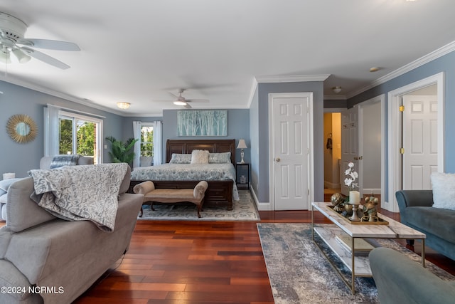 bedroom with dark hardwood / wood-style floors, ceiling fan, and ornamental molding