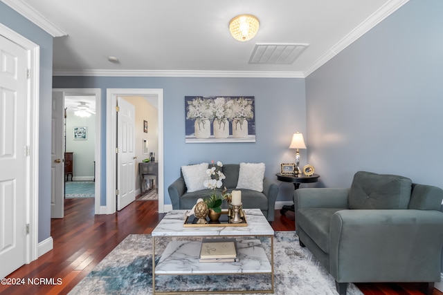 living room featuring crown molding and dark hardwood / wood-style flooring