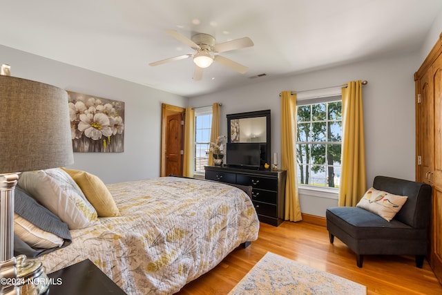 bedroom featuring ceiling fan and light hardwood / wood-style floors