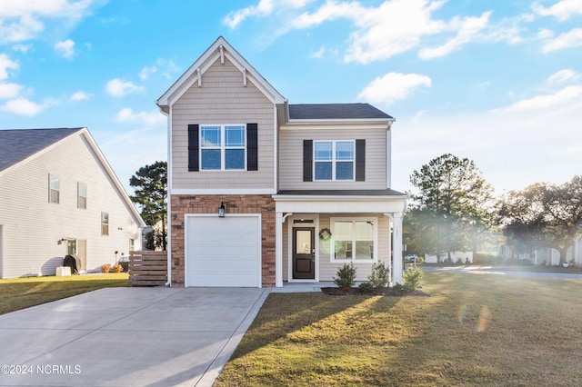 traditional home with driveway, stone siding, a garage, and a front yard