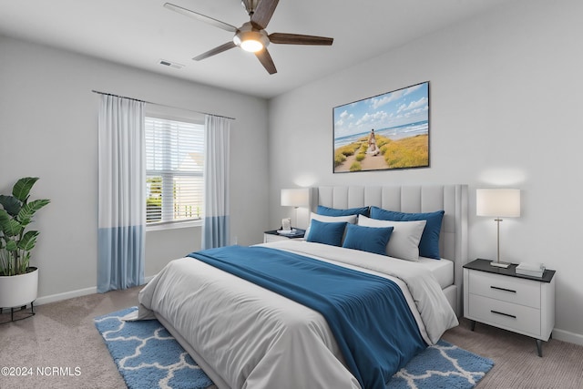 bedroom featuring a ceiling fan, carpet, visible vents, and baseboards