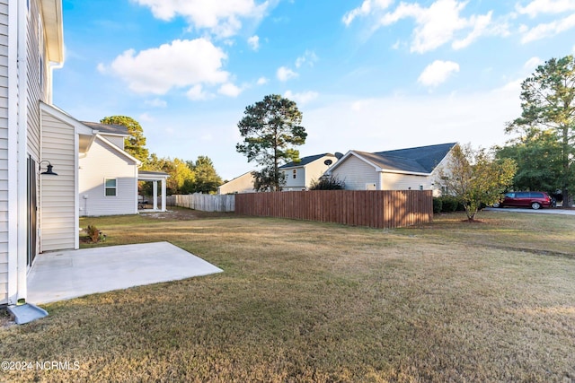 view of yard with a patio and fence