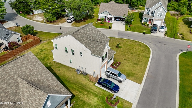 birds eye view of property with a residential view