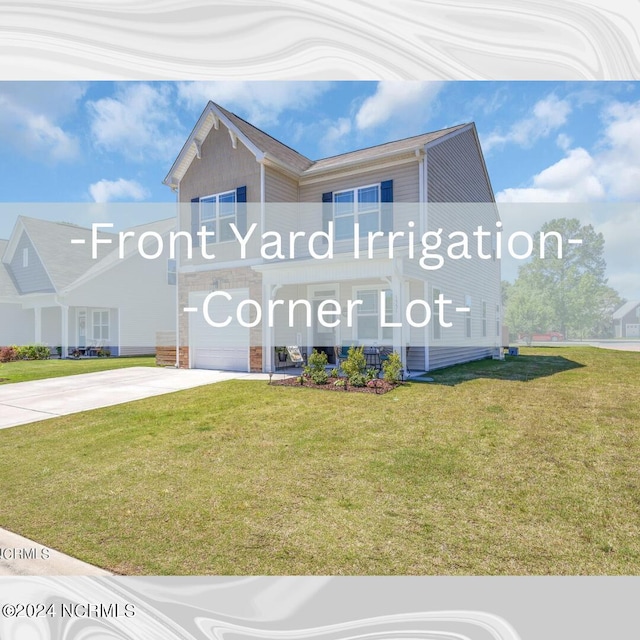 view of front facade featuring an attached garage, concrete driveway, and a front yard