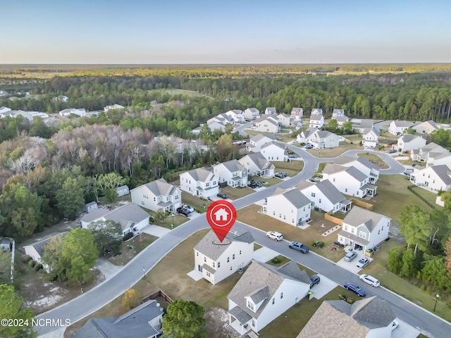 aerial view featuring a residential view and a view of trees