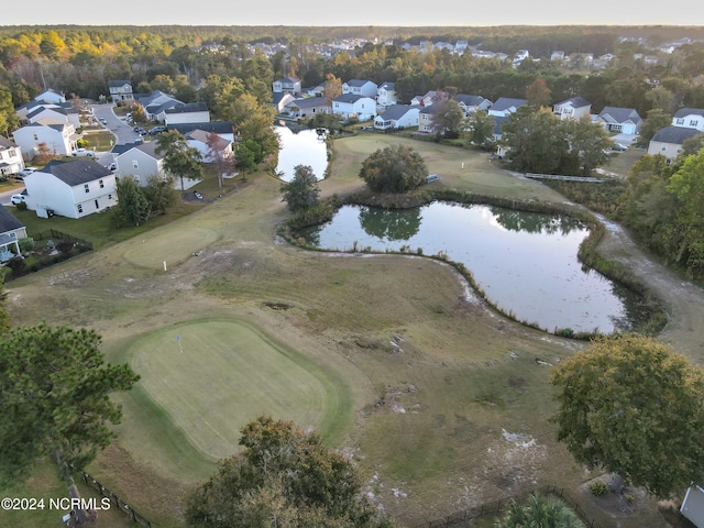 drone / aerial view with a water view and a residential view