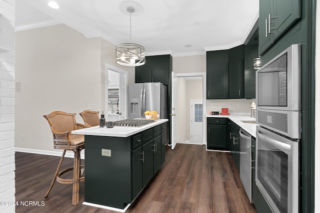 kitchen featuring a kitchen island, dark hardwood / wood-style flooring, a kitchen breakfast bar, stainless steel appliances, and decorative light fixtures