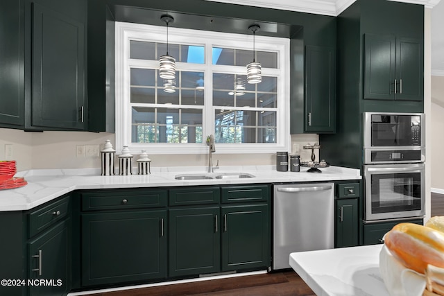 kitchen featuring appliances with stainless steel finishes, ornamental molding, sink, and dark hardwood / wood-style flooring