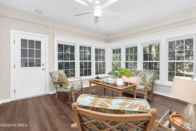 sunroom featuring ceiling fan