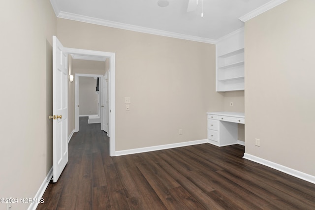 interior space with built in desk, crown molding, and dark hardwood / wood-style flooring