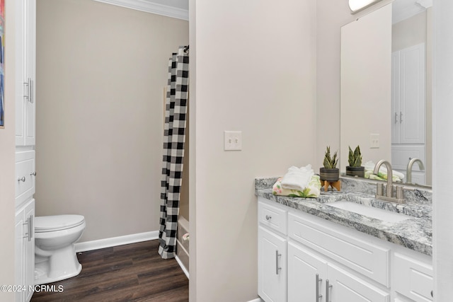 bathroom featuring toilet, a shower with curtain, vanity, crown molding, and hardwood / wood-style flooring