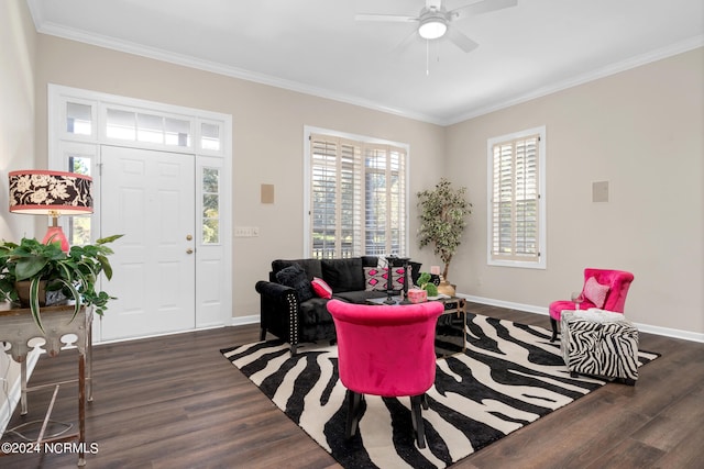 living room with dark wood-type flooring, ceiling fan, a healthy amount of sunlight, and ornamental molding