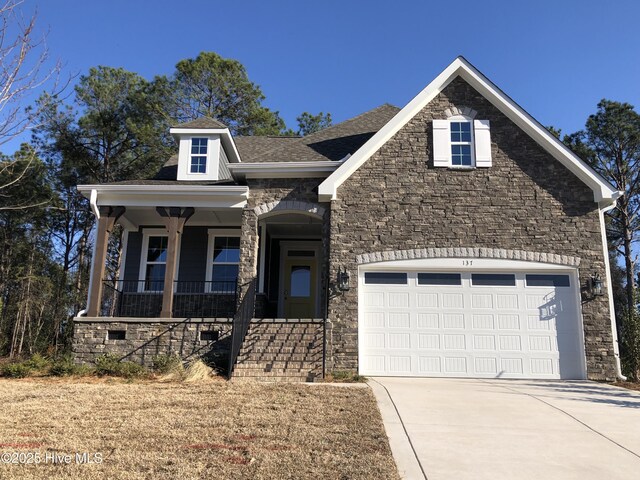 view of front of house with a front lawn and a garage