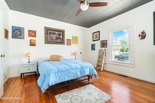 bedroom featuring ceiling fan and hardwood / wood-style floors