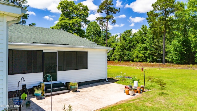 view of patio / terrace featuring a sunroom