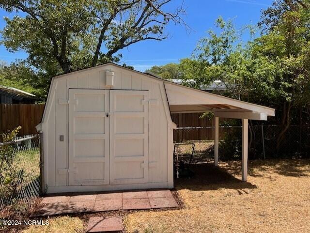 view of outdoor structure with a carport