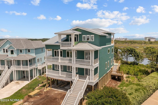 exterior space featuring a carport and a balcony