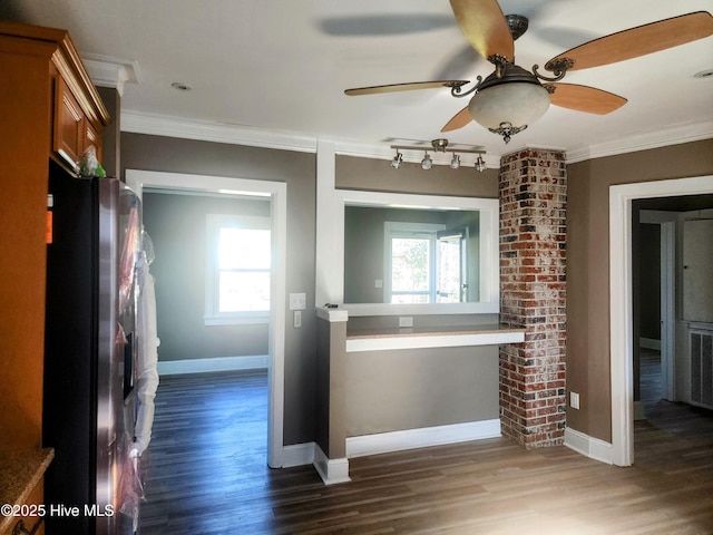 bathroom featuring ceiling fan, wood finished floors, baseboards, and ornamental molding