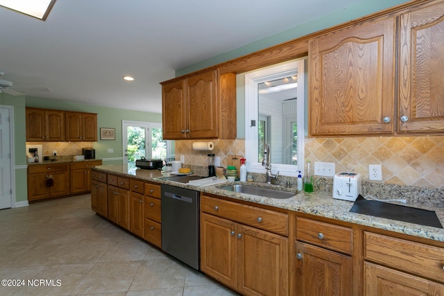 kitchen with tasteful backsplash, ceiling fan, light tile floors, and stainless steel dishwasher