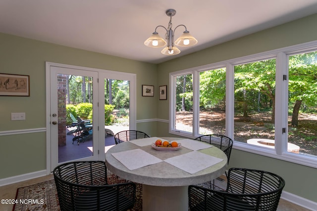 dining space featuring a notable chandelier