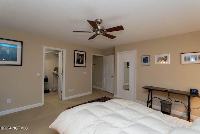 bedroom featuring carpet, a closet, ceiling fan, a spacious closet, and a textured ceiling